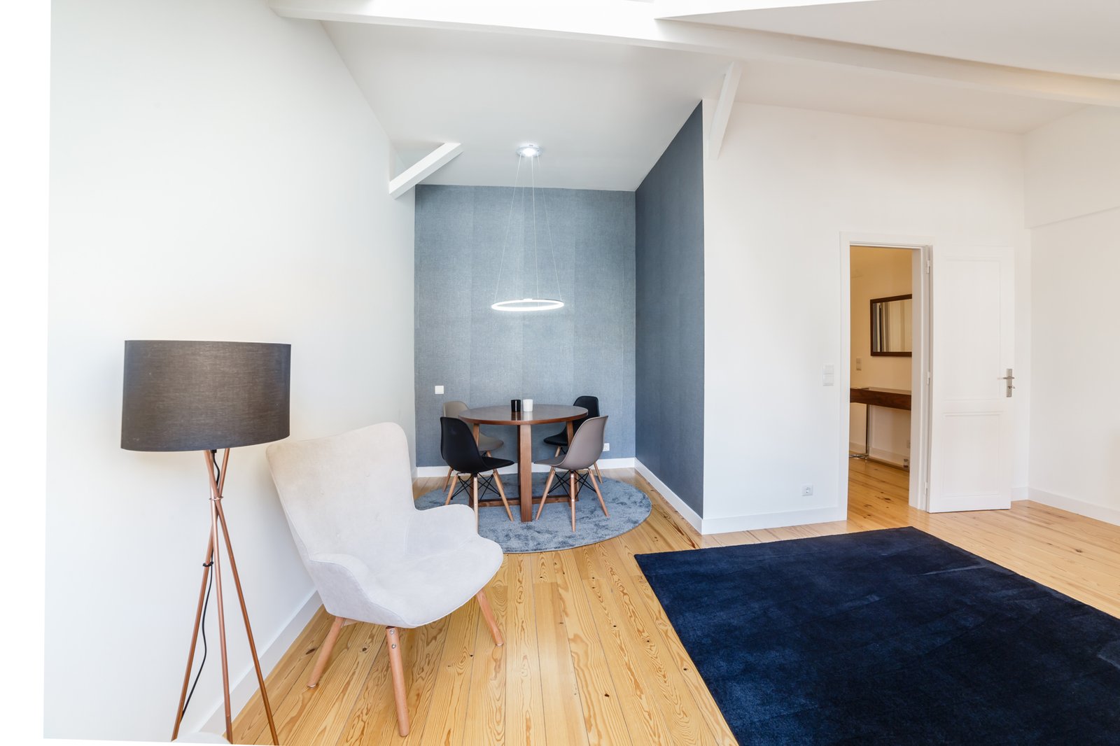 Modern apartment with white walls and light wooden floor Modern studio apartment